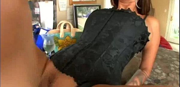  This hot brunette milf in a black corset is taking a big cock